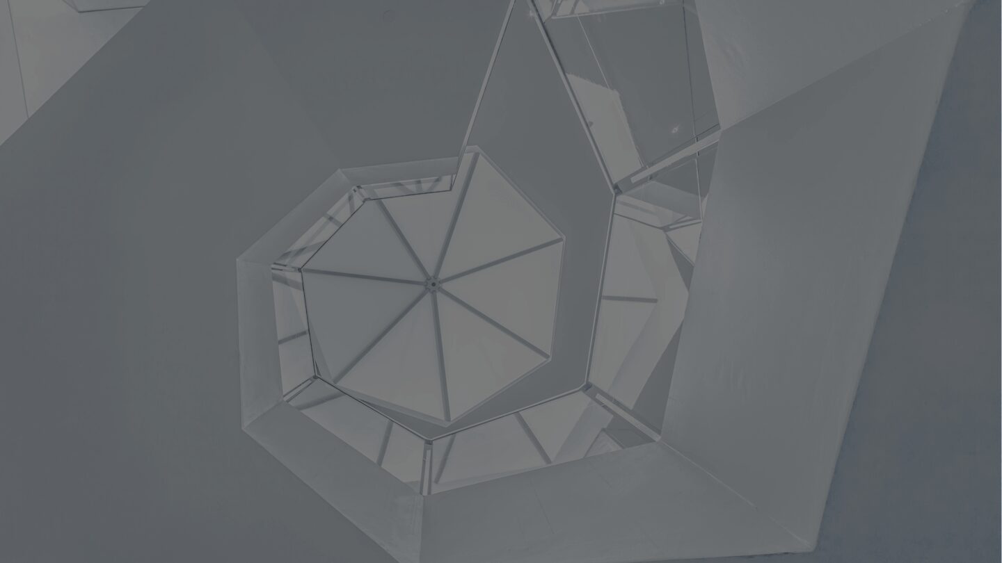 Geometric ceiling with triangular glass panels.