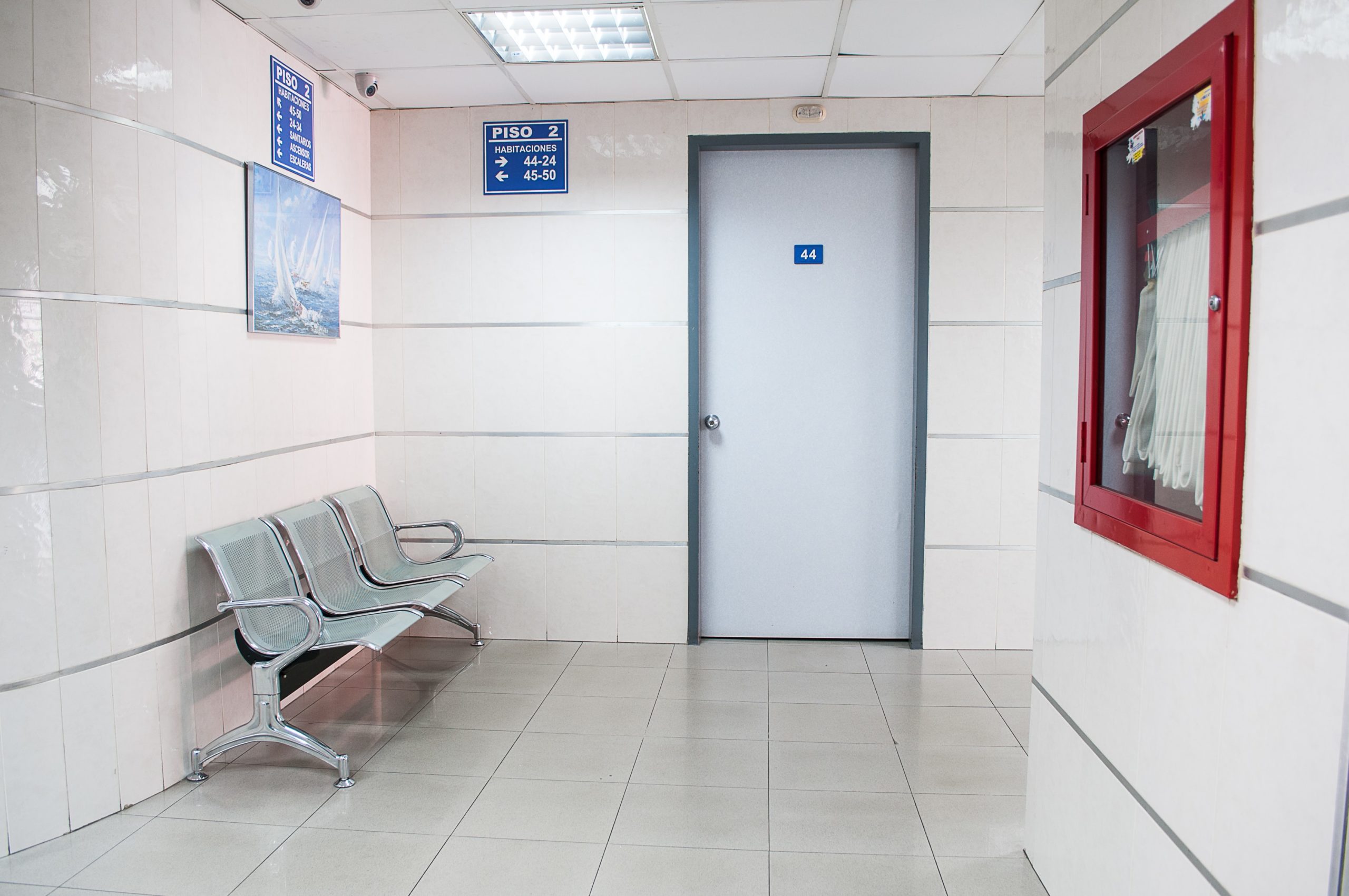 Waiting area with benches and a door.