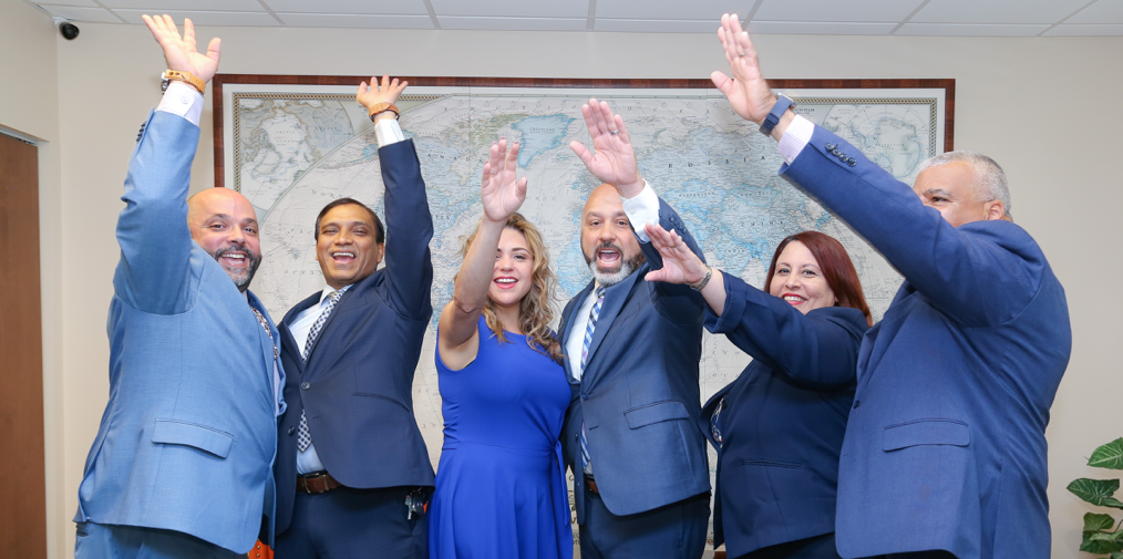 The team raising hands